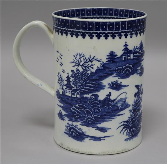 A Worcester blue and white mug, printed blue on white with fishermen, 15cm
